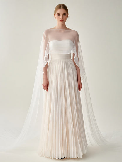 Elegant White Pleated Gown With Sheer Cape Overlay